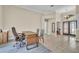Spacious office area with neutral walls, tile floors, and convenient access to the front entrance at 339 Hammock Dunes Pl, Orlando, FL 32828