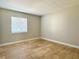 Bedroom featuring neutral walls, tile flooring, and a window with blinds at 4405 S Semoran Blvd # 4, Orlando, FL 32822