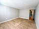 Spacious bedroom with tan tile floors and neutral walls and an open doorway at 4405 S Semoran Blvd # 4, Orlando, FL 32822