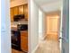 Welcoming condo entryway with tile floors leading to the kitchen, enhancing the home's appeal and functionality at 4405 S Semoran Blvd # 4, Orlando, FL 32822