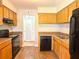 Well-organized kitchen featuring essential appliances and wooden cabinetry, creating a functional and inviting culinary space at 4405 S Semoran Blvd # 4, Orlando, FL 32822
