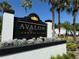 Elegant Avalon Condominiums sign featuring lush landscaping and palm trees on a bright, sunny day at 4405 S Semoran Blvd # 4, Orlando, FL 32822