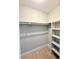 Walk-in closet with shelves and hanging rods at 4405 S Semoran Blvd # 4, Orlando, FL 32822