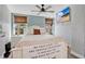 Bedroom with a bed, ceiling fan, and mounted TV at 4640 Hickory Tree Rd, St Cloud, FL 34772