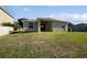 Expansive backyard with a well-maintained lawn and partial fencing at 4841 Hickory Stream Ln, Mulberry, FL 33860