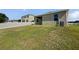A large backyard with a well-maintained lawn and privacy fencing at 4841 Hickory Stream Ln, Mulberry, FL 33860