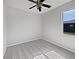 Cozy bedroom featuring neutral walls, carpet flooring, and a window offering exterior views at 4841 Hickory Stream Ln, Mulberry, FL 33860