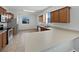 Bright kitchen features wooden cabinets, stainless steel appliances, and ample counter space at 4841 Hickory Stream Ln, Mulberry, FL 33860