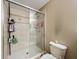 Elegant bathroom features a glass-enclosed shower with tiled walls and upgraded shower fixtures at 5050 Shorewood Landing Ln, Oviedo, FL 32765