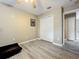 Wood-look floors and neutral walls fill this room with closet and open doorway at 5050 Shorewood Landing Ln, Oviedo, FL 32765