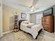 Comfortable bedroom featuring wood-look floors, neutral walls, and a decorative ceiling fan at 5050 Shorewood Landing Ln, Oviedo, FL 32765