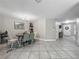 Elegant dining area adjacent to the living room with a chandelier at 5050 Shorewood Landing Ln, Oviedo, FL 32765