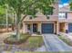 Inviting two-story townhome with a well-manicured lawn and attached garage at 5050 Shorewood Landing Ln, Oviedo, FL 32765