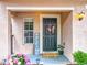Charming front entrance with a decorative wreath and a welcome sign at 5050 Shorewood Landing Ln, Oviedo, FL 32765