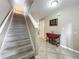 Hallway featuring stairs, decorative table with flowers, and wine rack at 5050 Shorewood Landing Ln, Oviedo, FL 32765