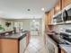 Functional kitchen layout with stainless steel appliances and tile flooring at 5050 Shorewood Landing Ln, Oviedo, FL 32765