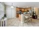 Bright kitchen features wood cabinets, an island with bar seating, and stainless steel appliances at 5050 Shorewood Landing Ln, Oviedo, FL 32765