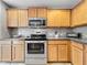 Modern kitchen featuring stainless steel appliances and ample cabinet space at 5050 Shorewood Landing Ln, Oviedo, FL 32765