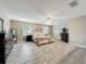 Spacious main bedroom with a ceiling fan, wood floors, and natural light at 5050 Shorewood Landing Ln, Oviedo, FL 32765