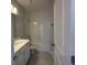 Clean bathroom featuring a shower-tub combo with tile surround and a modern vanity at 5268 Teirgarten St, St Cloud, FL 34771