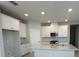 Bright kitchen with white cabinets, stainless steel appliances, and a center island at 5268 Teirgarten St, St Cloud, FL 34771