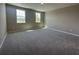 Large bedroom with natural light, plush carpeting, and neutral wall colors at 5330 Center Lake, St Cloud, FL 34771