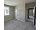 Neutral bedroom features a bright window, plush carpeting, and closet at 5330 Center Lake, St Cloud, FL 34771