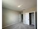 Neutral bedroom featuring a plush carpet, walk-in closet, and ensuite bathroom at 5330 Center Lake, St Cloud, FL 34771