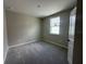 Neutral bedroom with carpet, bright window, and fresh, clean decor at 5330 Center Lake, St Cloud, FL 34771