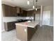 Modern kitchen featuring an island, stainless steel appliances, and plenty of cabinet space at 5330 Center Lake, St Cloud, FL 34771