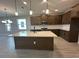 Stylish kitchen featuring a large island, quartz countertops, and stainless steel appliances at 5330 Center Lake, St Cloud, FL 34771