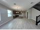 Open-concept kitchen featuring an island, modern lighting, and stainless steel appliances at 5330 Center Lake, St Cloud, FL 34771