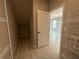 Open pantry area with wire shelving and tile flooring, connecting to living room and additional storage space at 5330 Center Lake, St Cloud, FL 34771