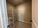 Walk-in pantry with wire shelving and tile flooring, providing ample storage space at 5330 Center Lake, St Cloud, FL 34771