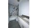 New bathroom featuring marble tiled shower, vanity with marble countertop, and toilet at 563 Winogene Ave, Umatilla, FL 32784