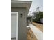 Exterior of new construction home featuring a walkway, gray paint, and the house number 563 at 563 Winogene Ave, Umatilla, FL 32784