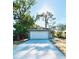 Charming single-story home with a modern gray exterior and a spacious two-car garage at 563 Winogene Ave, Umatilla, FL 32784