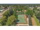 Aerial view showcasing community basketball courts surrounded by lush green trees at 5943 Sunderland Dr, Orlando, FL 32812