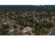 Aerial view showcasing a home in its neighborhood context, surrounded by mature landscaping at 5943 Sunderland Dr, Orlando, FL 32812