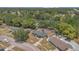 Aerial view of the property showcasing a large backyard with a trampoline, shed, and surrounding neighborhood at 5943 Sunderland Dr, Orlando, FL 32812