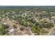 Aerial view of the residential neighborhood with mature trees and community amenities at 5943 Sunderland Dr, Orlando, FL 32812