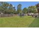 Well maintained backyard with a trampoline, shed, privacy fence, and an outdoor sitting area at 5943 Sunderland Dr, Orlando, FL 32812