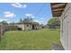 Spacious backyard with a trampoline, shed, fenced perimeter, and outdoor seating at 5943 Sunderland Dr, Orlando, FL 32812