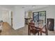 An inviting dining room with access to the kitchen and a sliding door with direct access to the backyard at 5943 Sunderland Dr, Orlando, FL 32812