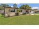 Charming single-story home with well-maintained lawn, fresh landscaping, and a welcoming front porch at 5943 Sunderland Dr, Orlando, FL 32812