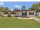 Charming single-story home with well-maintained lawn, fresh landscaping, and a welcoming front porch at 5943 Sunderland Dr, Orlando, FL 32812