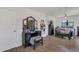 The main bedroom offers natural light, tile floors, a ceiling fan, and plenty of space for a makeup vanity at 5943 Sunderland Dr, Orlando, FL 32812