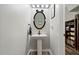 Charming powder room with pedestal sink and whimsical Mickey Mouse themed mirror at 6672 S Goldenrod Rd # 132B, Orlando, FL 32822