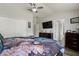 Spacious bedroom with closet, TV and dresser at 6672 S Goldenrod Rd # 132B, Orlando, FL 32822