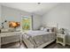 Bright bedroom includes a desk, chair, TV and large window with a beautiful view at 6672 S Goldenrod Rd # 132B, Orlando, FL 32822